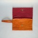 Orange leather purse with studs