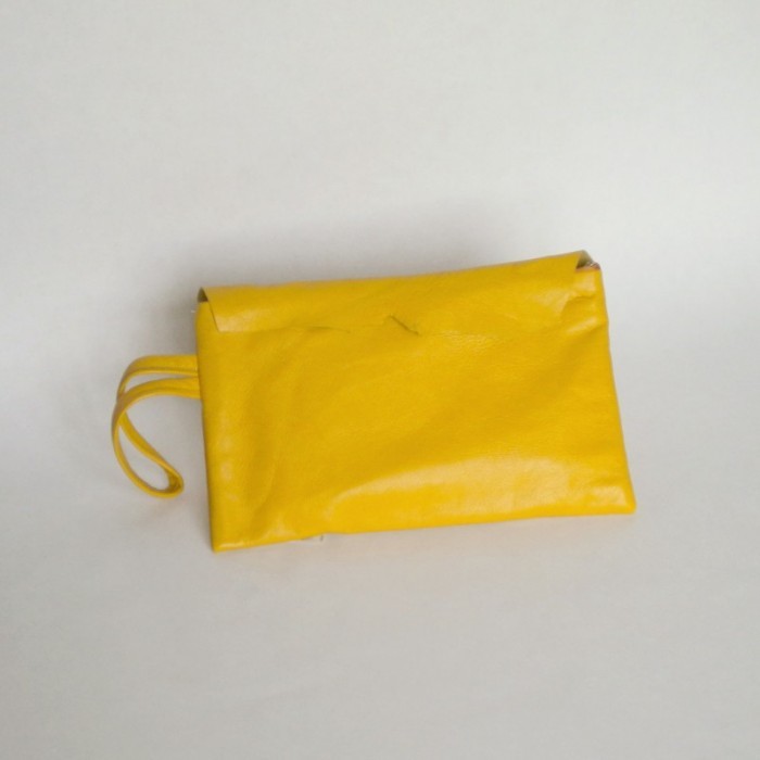 Yellow leather purse with flap