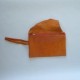Orange leather clutch with flap