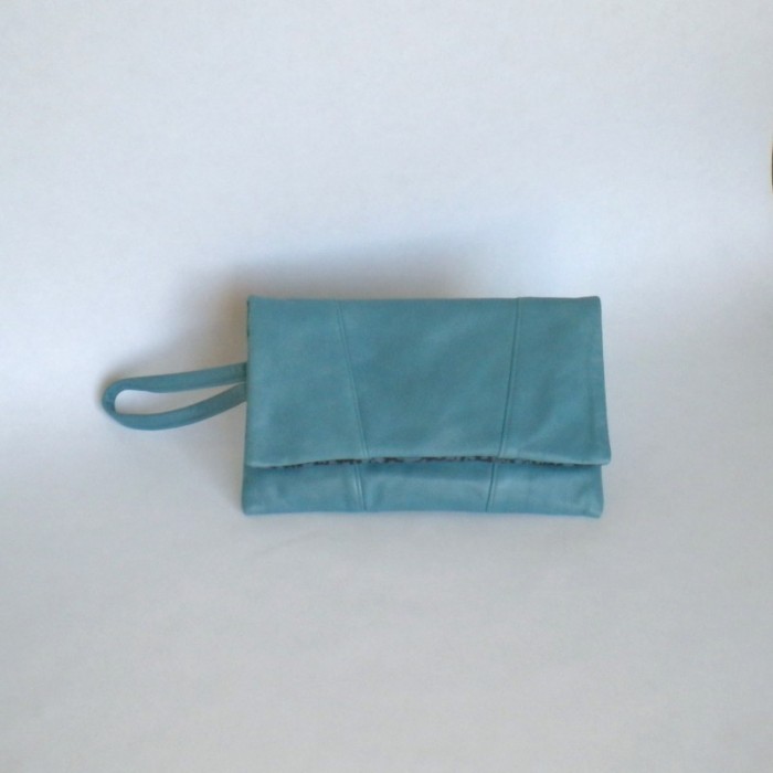 Blue leather clutch bag with panels