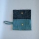 Blue leather clutch bag with panels