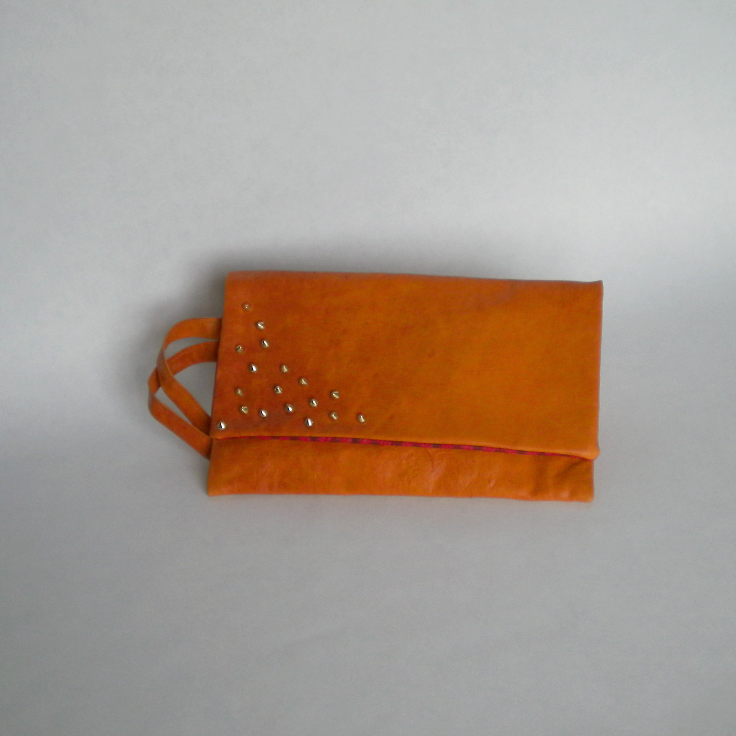  Orange leather clutch with studs 